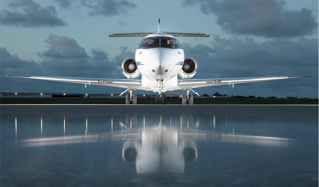 private jet on tarmac at sundown